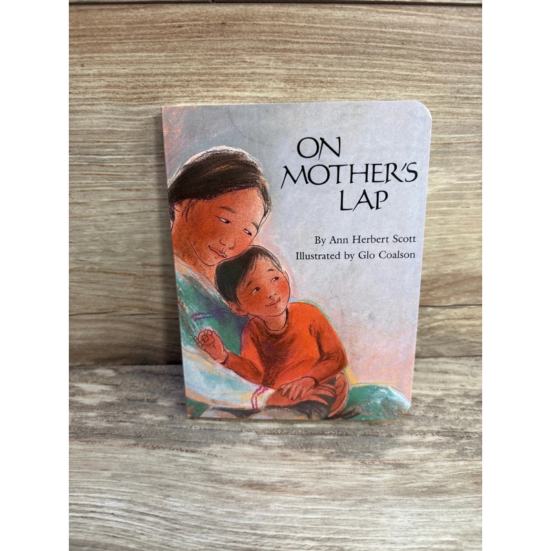 On Mother’s Lap Hardcover Book